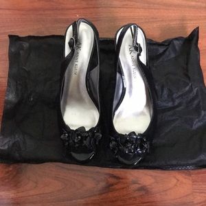 Lightly worn black heels with small detail